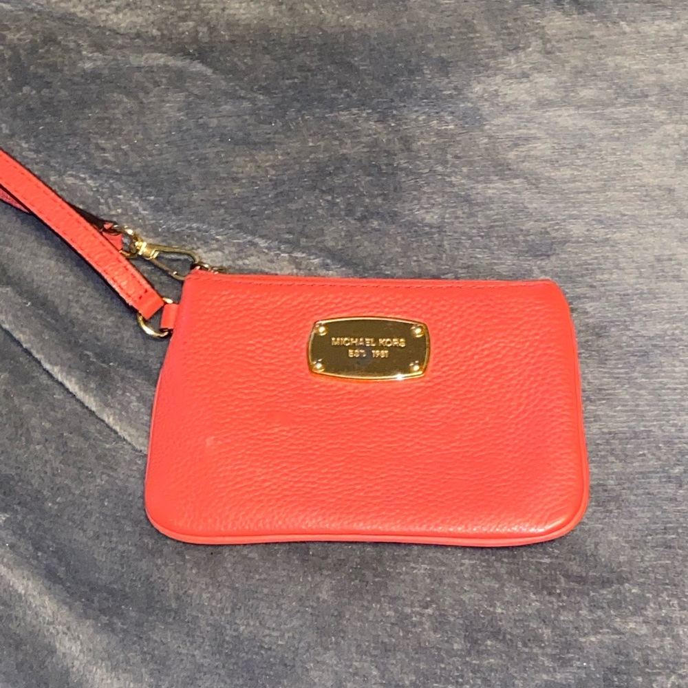 Michael Kors fuchsia colored wristlet
